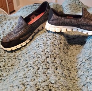 Skechers slip-on shoes. Size: 8½ Black and grey with white soles.